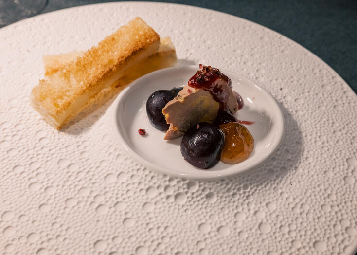 Foie gras terrine served with fruit accompaniments and toasted brioche.