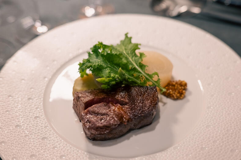 Sliced Wagyu beef with daikon, sweet potato, greens and wholegrain mustard.